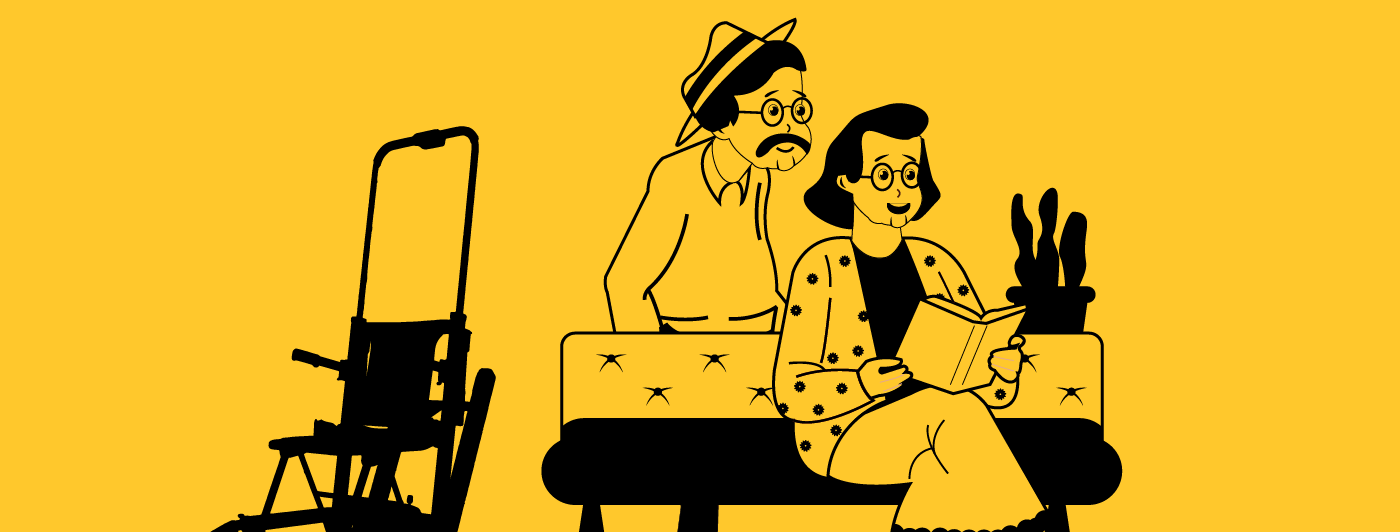 two seniors at home reading a book with a stairlift next to them