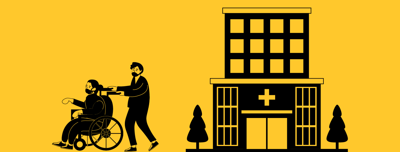 silhouette of two people outside of a hospital, one in a wheelchair