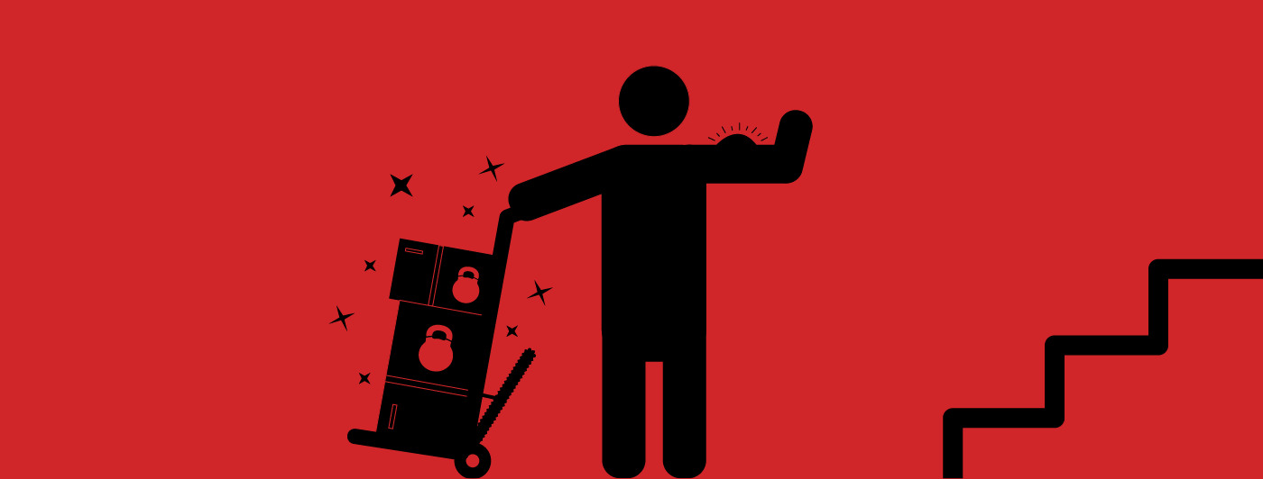 Silhouette of a person flexing as they use a motorized hand truck to lift heavy items