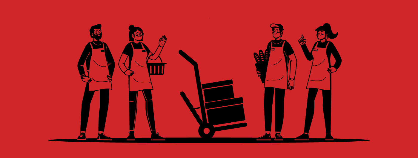 Supermarket employees smiling around a motorized hand truck