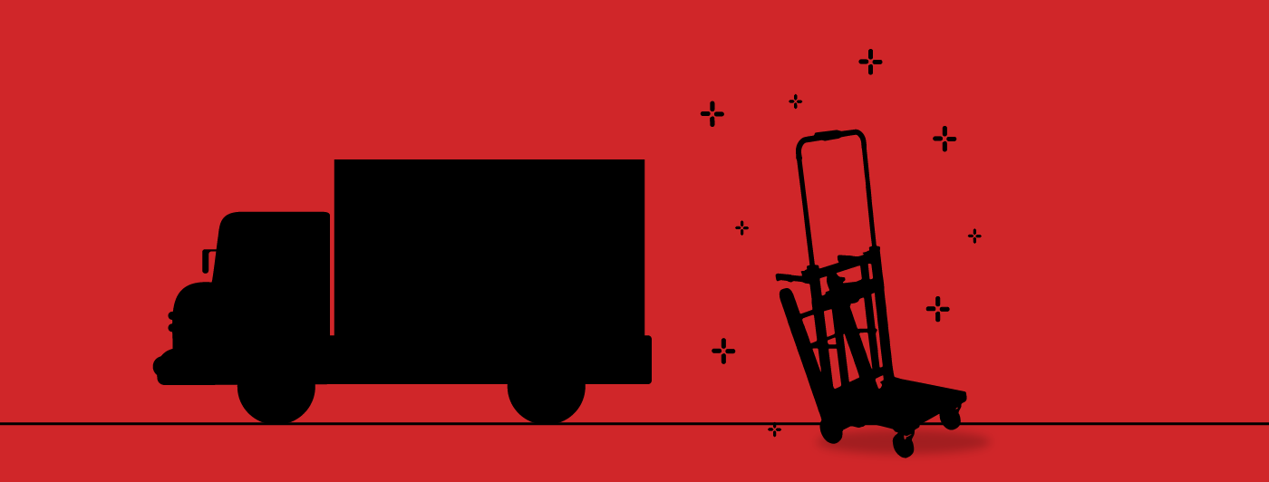 A delivery truck standing next to a Voltstair Motorized Electric Hand Truck