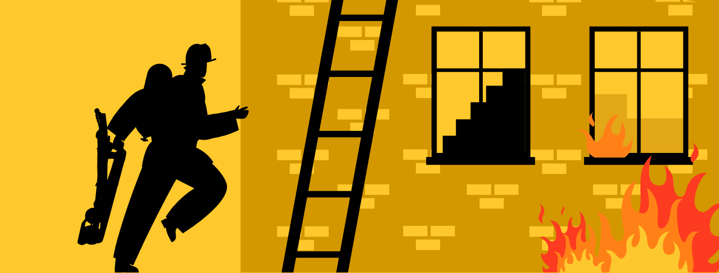 A fire fighter carrying a stair chair