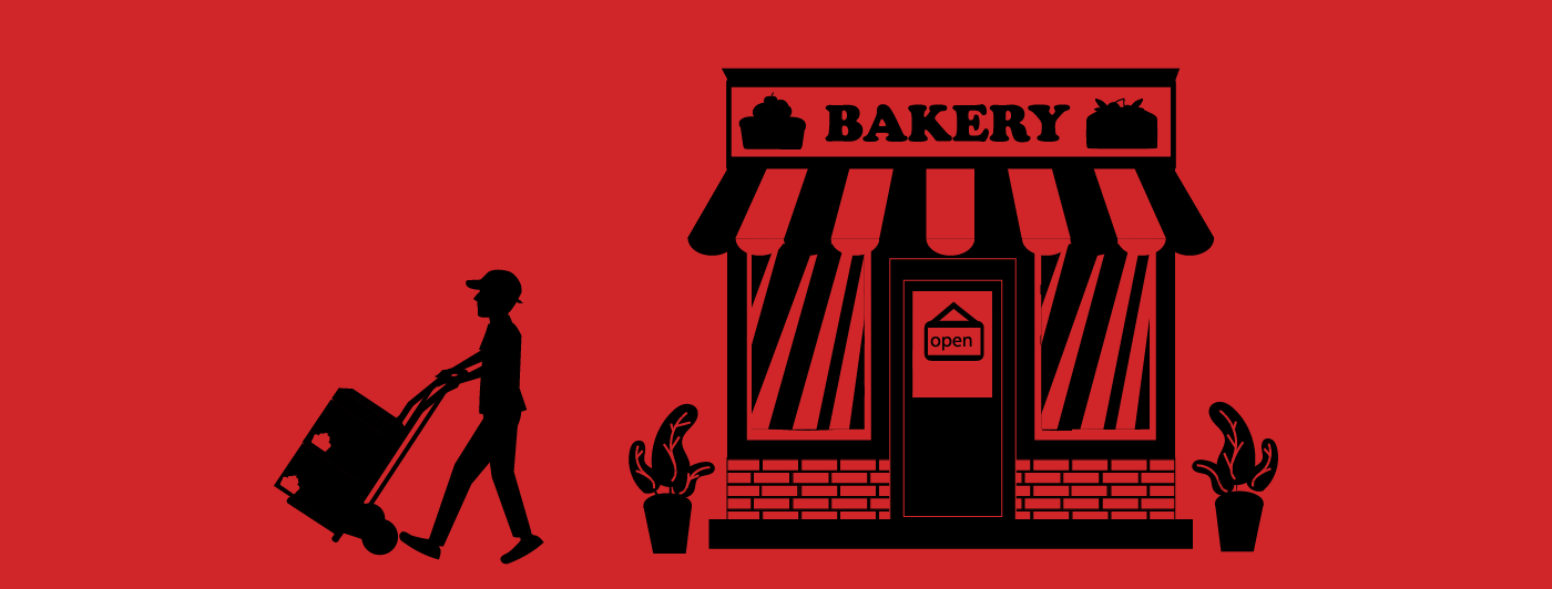 A delivery person taking boxes in a motorized hand truck